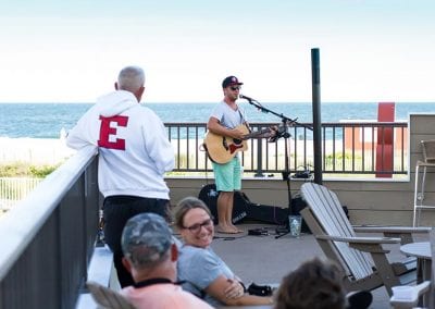 Harry's live performance on oceanfront rooftop deck.